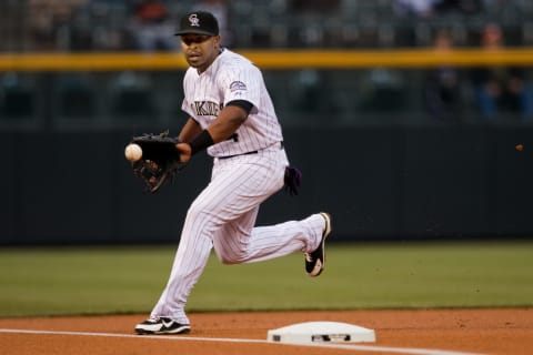 DENVER, CO – APRIL 19: Third baseman Chris Nelson #4 of the Colorado Rockies fields a ground ball before throwing to first for the second out of the first inning against the Arizona Diamondbacks at Coors Field on April 19, 2013 in Denver, Colorado. (Photo by Justin Edmonds/Getty Images)