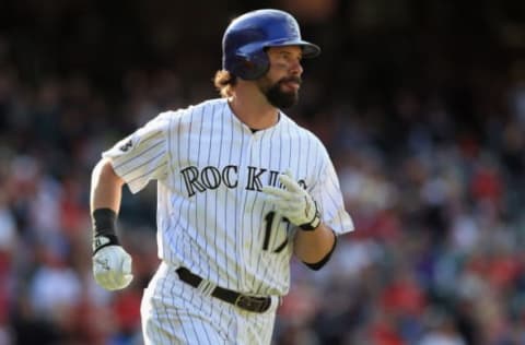 DENVER, CO – SEPTEMBER 19: Todd Helton #17 of the Colorado Rockies rounds the bases on his solo home run off of Edward Mujica #44 of the St. Louis Cardinals to tie the score 6-6 in the ninth inning at Coors Field on September 19, 2013 in Denver, Colorado. The Rockies defeated the Cardinals 7-6 in 15 innings. (Photo by Doug Pensinger/Getty Images)