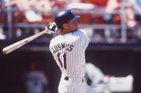 12 Aug 1993: Catcher Brad Ausmus of the San Diego Padres makes contact with a pitch during the Padres versus Houston Astros game at Jack Murphy Stadium in San Diego, California. Mandatory Credit: Stephen Dunn/ALLSPORT