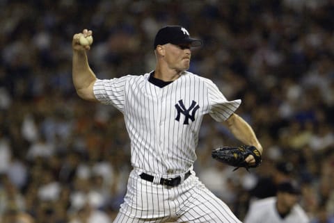 BRONX, NY- AUGUST 8: Pitcher Jeff Nelson #43 of the New York Yankees delivers a pitch during eighth inning against the Seattle Mariners in the American League game at Yankee Stadium on August 8, 2003 in the Bronx, New York. The Yankees defeated the Mariners 9-7. (Photo by Chris Trotman/Getty Images)