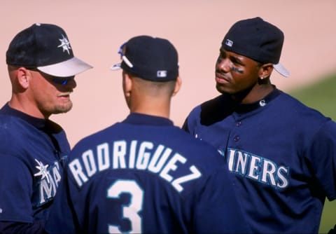 8 Mar 1998: (L-R) Jay Buhner #19, Alex Rodriguez #3 and Ken Griffey Jr. #24 of the Seattle Mariners talk during a spring training game against the Colorado Rockies at the Peoria Sports Complex in Peoria, Arizona. The Mariners defeated the Rockies 12-6.