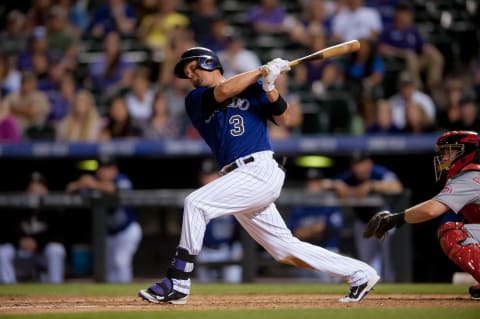 DENVER, CO – AUGUST 17: Michael Cuddyer #3 of the Colorado Rockies hits a solo home run hit in the sixth inning during the second game of a split doubleheader at Coors Field on August 17, 2014 in Denver, Colorado. Cuddyer would complete a cycle during the game. (Photo by Dustin Bradford/Getty Images)