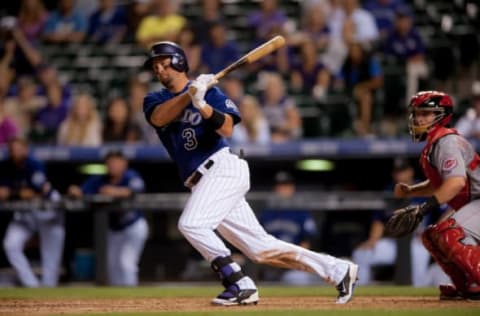 DENVER, CO – AUGUST 17: Michael Cuddyer #3 of the Colorado Rockies doubles, knocking in two runs and completing the cycle in the eighth inning during the second game of a split double header at Coors Field on August 17, 2014 in Denver, Colorado. (Photo by Dustin Bradford/Getty Images)