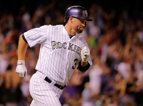 DENVER, CO – SEPTEMBER 19: Michael Cuddyer #3 of the Colorado Rockies rounds the bases on his grand slam home run of of Eury De La Rosa #56 of the Arizona Diamondbacks to give the Rockies a 11-2 lead in the sixth inning at Coors Field on September 19, 2014 in Denver, Colorado. (Photo by Doug Pensinger/Getty Images)