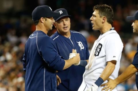 DETROIT, MI – MAY 08: Ian Kinsler #3 of the Detroit Tigers celebrates with manager Brad Ausmus and hitting coach Wally Joyner after the winning run scored on a throwing error after his ninth inning bunt to beat the Kansas City Royals 6-5 at Comerica Park on May 8, 2015 in Detroit, Michigan. (Photo by Gregory Shamus/Getty Images)