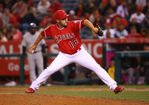 ANAHEIM, CA – MAY 12: Pitcher Huston Street #16 of the Los Angeles Angels of Anaheim pitches in the ninth inning during the MLB game against the Colorado Rockies at Angel Stadium of Anaheim on May 12, 2015 in Anaheim, California. The Angels defeated the Rockies 5-2. (Photo by Victor Decolongon/Getty Images)