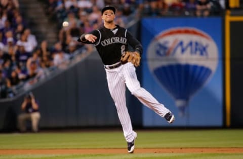 DENVER, CO – JUNE 23: Shortstop Troy Tulowitzki #2 of the Colorado Rockies throws out a runner against the Arizona Diamondbacks at Coors Field on June 23, 2015 in Denver, Colorado. The Rockies defeated the Diamondbacks 10-5. (Photo by Doug Pensinger/Getty Images)