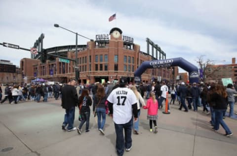 DENVER, CO – APRIL 04: Fans cross Blake and 20th Streets as they enter the ballpark to see the Arizona Diamondbacks face the Colorado Rockies during the home opener at Coors Field on April 4, 2014 in Denver, Colorado. The Rockies defeated the Diamondbacks 12-2. (Photo by Doug Pensinger/Getty Images)