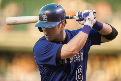 DENVER, CO – SEPTEMBER 25: Corey Dickerson #6 of the Colorado Rockies warms up in the on deck circle during a game against the Los Angeles Dodgers at Coors Field on September 25, 2015 in Denver, Colorado. (Photo by Dustin Bradford/Getty Images)