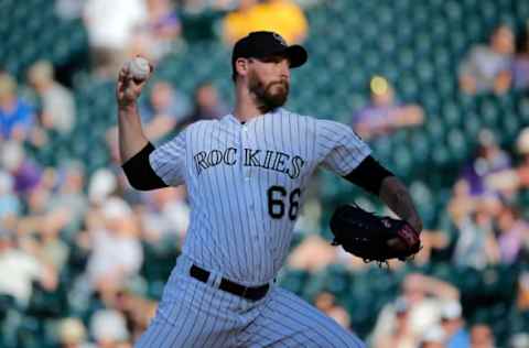 DENVER, CO – SEPTEMBER 24: Relief pitcher John Axford #66 of the Colorado Rockies delivers against the Pittsburgh Pirates at Coors Field on September 24, 2015 in Denver, Colorado. The Pirates defeated the Rockies 5-4. (Photo by Doug Pensinger/Getty Images)