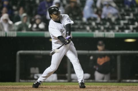 DENVER – JUNE 18: Vinny Castilla #9 of the Colorado Rockies swings at the pitch during the game against the Baltimore Orioles on June 18, 2004 at Coors Field in Denver, Colorado. The Rockies won 5-3. (Photo by Brian Bahr/Getty Images)