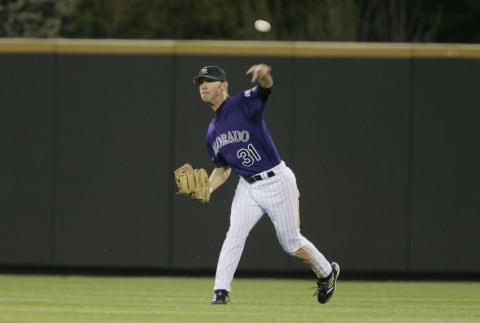 DENVER – APRIL 18: Cory Sullivan #31 of the Colorado Rockies throws the ball against the Arizona Diamondbacks on April 18, 2005 at Coors Field in Denver, Colorado. The Diamondbacks won 5-3. (Photo by Brian Bahr/Getty Images)