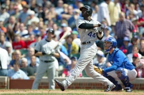 CHICAGO – MAY 26: Preston Wilson, #44 of the Colorado Rockies hits his 5th home run of the season in the 5th inning off of Cliff Bartosh during the game against the Chicago Cubs at Wrigley Field on May 26, 2005 in Chicago, Illinois. The Cubs were defeated by the Rockies 5-2. (Photo by Ron Vesely/MLB Photos via Getty Images)