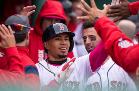 BOSTON, MA – MAY 13: Mookie Betts is congratulated after he scored after a Xander Bogaerts hit during the fifth inning of a game against the Tampa Bay Rays at Fenway Park on May 13, 2017 in Boston, Massachusetts. Players are wearing pink to celebrate Mother’s Day weekend and support breast cancer awareness. (Photo by Rich Gagnon/Getty Images)