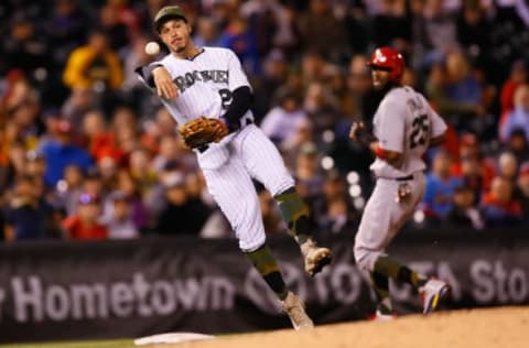 DENVER, CO – MAY 27: Third baseman Nolan Arenado #28 of the Colorado Rockies makes a throw on the run to first base for the third out of the ninth inning as Dexter Fowler #25 of the St Louis Cardinals looks on at Coors Field on May 27, 2017 in Denver, Colorado. The Cardinals defeated the Rockies 3-0. (Photo by Justin Edmonds/Getty Images)