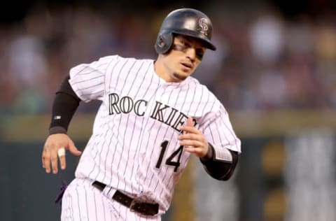 DENVER, CO – JUNE 16: Tony Wolters #14 of the Colorado Rockies circles the bases to score on a Chalrie Blackmon RBI triple in the fifth inning against the San Francisco Giants at Coors Field on June 16, 2017 in Denver, Colorado. (Photo by Matthew Stockman/Getty Images)