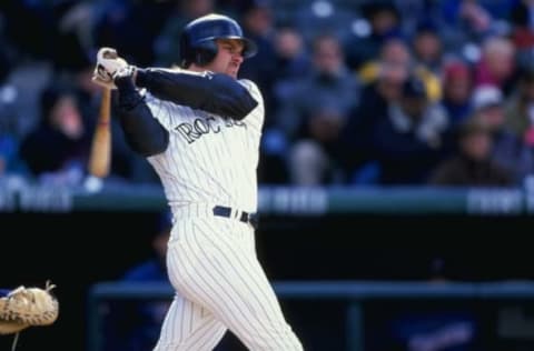 15 Apr 1999: Larry Walker #33 of the Colorado Rockies swings at the ball during the game against the San Diego Padres at Coors Field in Denver, Colorado. The Rockies defeated the Padres 6-4.