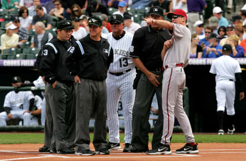 DENVER – APRIL 02: Manager Bob Melvin (R) #3 of the Arizona Diamondbacks and manager Clint Hurdle #13 of the Colorado Rockies go over the ground rules with the umpire crew during Opening Day of Major League Baseball on April 2, 2007 at Coors Field in Denver, Colorado. (Photo by Doug Pensinger/Getty Images)