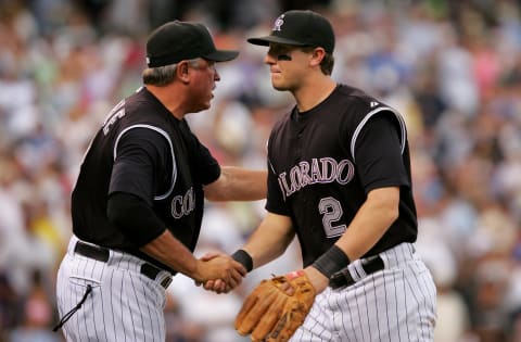 DENVER – JUNE 21: Troy Tulowitzki #2 of the Colorado Rockies is congratulated by manager Clint Hurdle #13 as he leaves the field after they swept the series with the New York Yankees as the Rockies defeated the Yankees 4-3 during Interleague play at Coors Field on June 21, 2007 in Denver, Colorado. (Photo by Doug Pensinger/Getty Images)