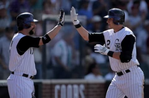 DENVER – SEPTEMBER 20: Troy Tulowitzki #2 of the Colorado Rockies is congratulated by Todd Helton #17 for his two-run home run to give the Rockies a 9-4 seventh inning lead at Coors Field on September 20, 2007 in Denver, Colorado. The Rockies defeated the Dodgers 9-4 to complete a four game series sweep. (Photo by Doug Pensinger/Getty Images)