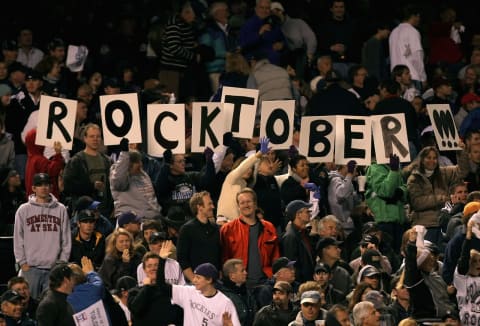 DENVER – OCTOBER 15: Fans of the Colorado Rockies spell out “Rocktober” in signs during Game Four of the National League Championship Series against the Arizona Diamondbacks at Coors Field on October 15, 2007 in Denver, Colorado. (Photo by Harry How/Getty Images)