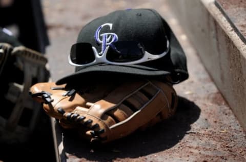 DENVER – APRIL 06: Close-up of the baseball cap, sunglasses and glove of Matt Holliday #5 of the Colorado Rockies on the steps of the Rockies dugout during the MLB game against the Arizona Diamondbacks at Coors Field on April 6, 2008 in Denver, Colorado. (Photo by Steve Dykes/Getty Images)