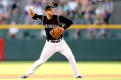 DENVER, CO – JULY 08: Nolan Arenado #28 of the Colorado Rockies throws out Melky Cabrera #53 of the Chicago White Sox in the first inning at Coors Field on July 8, 2017 in Denver, Colorado. (Photo by Matthew Stockman/Getty Images)