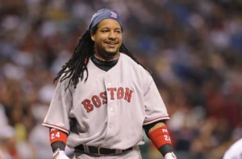 ST PETERSBURG, FL – July 2: Designated hitter Manny Ramirez #24 of the Boston Red Sox smiles after ducking from an inside pitch against the Tampa Bay Rays July 2, 2008 at Tropicana Field in St. Petersburg, Florida. (Photo by Al Messerschmidt/Getty Images)