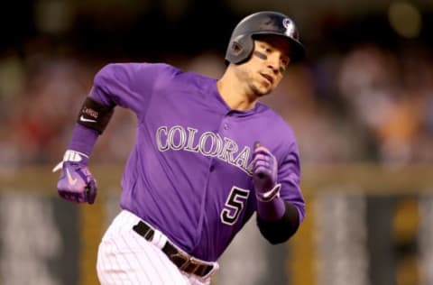 DENVER, CO – JULY 18: Carlos Gonzalez #5 of the Colorado Rockies scores on a Alexi Amarista RBI single in the fifth inning against the San Diego Padres at Coors Field on July 18, 2017 in Denver, Colorado. (Photo by Matthew Stockman/Getty Images)