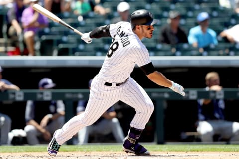 Nolan Arenado of the Colorado Rockies hits a RBI single in the first inning against the San Diego Padres at Coors Field on July 19, 2017 in Denver, Colorado. (Photo by Matthew Stockman/Getty Images)