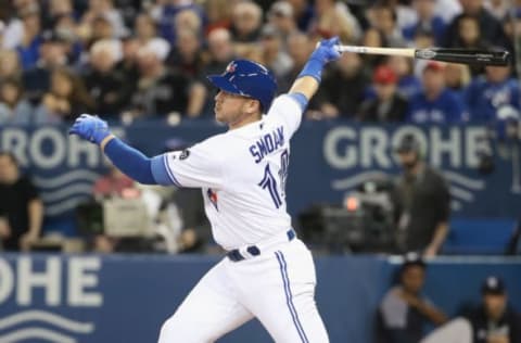 TORONTO, ON – MARCH 30: Justin Smoak #14 of the Toronto Blue Jays hits a double in the first inning during MLB game action against the New York Yankees at Rogers Centre on March 30, 2018 in Toronto, Canada. (Photo by Tom Szczerbowski/Getty Images)