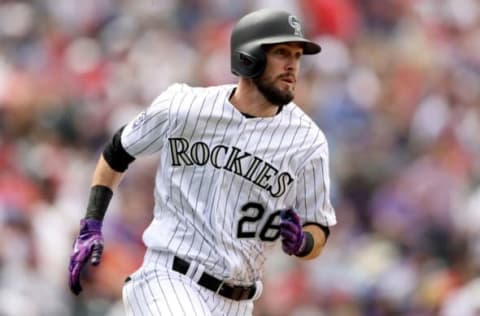 DENVER, CO – MAY 09: David Dahl #26 of the Colorado Rockies hits a double in the third inning against the Los Angeles Angels of Anaheim at Coors Field on May 9, 2018 in Denver, Colorado. (Photo by Matthew Stockman/Getty Images)