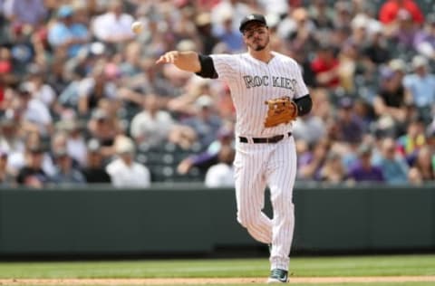 DENVER, CO – MAY 09: Nolan Arenado #28 of the Colorado Rockies throws out Andrelton Simmons #2 of the Los Angeles Angels of Anaheim in the sixth inning at Coors Field on May 9, 2018 in Denver, Colorado. (Photo by Matthew Stockman/Getty Images)