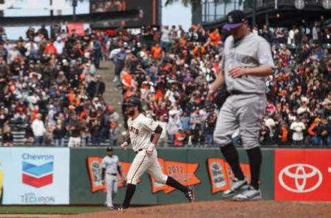 SAN FRANCISCO, CA – MAY 20: Brandon Belt #9 of the San Francisco Giants rounds the bases after hitting a three run home run off of Jake McGee #51 of the Colorado Rockies during the seventh inning at AT&T Park on May 20, 2018 in San Francisco, California. The San Francisco Giants defeated the Colorado Rockies 9-5. (Photo by Jason O. Watson/Getty Images)