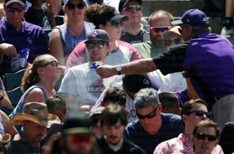 DENVER, CO – MAY 27: An usher sprays water on a fan at Coors Field during a game between the Colorado Rockies and Cincinnati Reds on May 27, 2018 in Denver, Colorado. (Photo by Joe Mahoney/Getty Images)