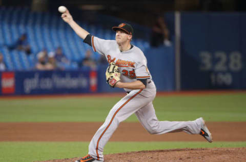 TORONTO, ON – JUNE 7: Brad Brach #35 of the Baltimore Orioles delivers a pitch in the ninth inning during MLB game action against the Toronto Blue Jays at Rogers Centre on June 7, 2018 in Toronto, Canada. (Photo by Tom Szczerbowski/Getty Images)