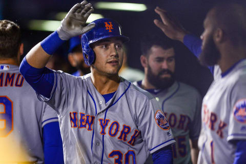 DENVER, CO – JUNE 19: Michael Conforto #30 of the New York Mets celebrates a run scored against the Colorado Rockies at Coors Field on June 19, 2018 in Denver, Colorado. (Photo by Dustin Bradford/Getty Images)