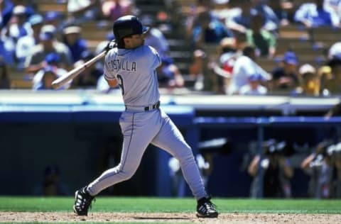 22 Jul 1999: Vinny Castilla #9 of the Colorado Rockies swings at the ball during the game against the Los Angeles Dodgers at the Dodger Stadium in Los Angeles, California. The Rockies defeated the Dodgers 4-1. Getty Images.