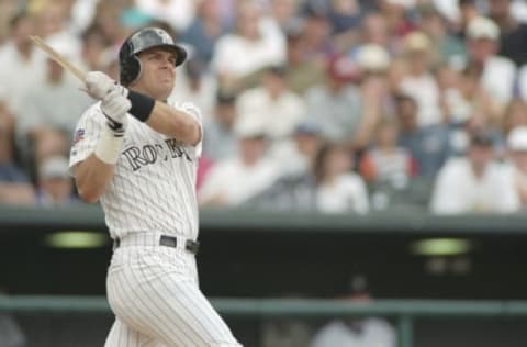 25 May 1997: Outfielder Larry Walker of the Colorado Rockies hits the ball during a game against the Houston Astros at Coors Field in Denver, Colorado. The Rockies won the game, 8-5. Mandatory Credit: Brian Bahr/Allsport. Getty Images.