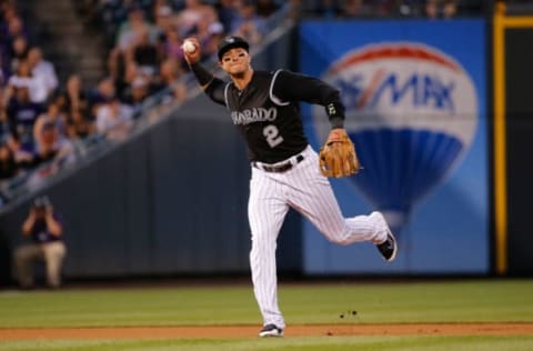 DENVER, CO – JUNE 23: Shortstop Troy Tulowitzki #2 of the Colorado Rockies throws out a runner against the Arizona Diamondbacks at Coors Field on June 23, 2015 in Denver, Colorado. The Rockies defeated the Diamondbacks 10-5. (Photo by Doug Pensinger/Getty Images)