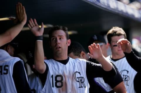 DENVER – SEPTEMBER 18: Cory Sullivan #18 of the Colorado Rockies is congratulated by his teammates after scoring his second run of the day on a Todd Helton single to right field to give the Rockies a 2-0 sixth inning lead over the Los Angeles Dodgers at Coors Field on September 18, 2007 in Denver, Colorado. The Rockies defeated the Dodgers 3-1 in the first game of a double header. (Photo by Doug Pensinger/Getty Images)