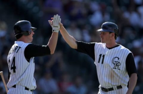 DENVER – SEPTEMBER 18: Ian Stewart #24 congratulates Brad Hawpe #11 of the Colorado Rockies as Hawpe scored on a Joe Koshansky double to give the Rockies a 3-1 lead in the seventh inning against the Los Angeles Dodgers at Coors Field on September 18, 2007 in Denver, Colorado. Tthe Rockies defeated the Dodgers 3-1 in the first game of a double header. (Photo by Doug Pensinger/Getty Images)