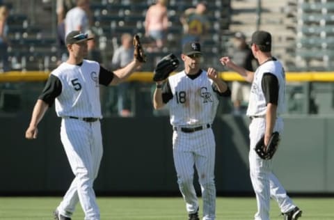 DENVER – SEPTEMBER 18: Matt Holliday #5 ,Cory Sullivan #18 and Brad Hawpe #11 of the Colorado Rockies celebrate in the outfield during the game against the Los Angeles Dodgers at Coors Field on September 18, 2007 in Denver, Colorado. The Rockies defeated the Dodgers 3-1 in the first game of a double header. (Photo by Doug Pensinger/Getty Images)