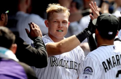 DENVER, CO – JULY 23: Pat Valaika #4 of the Colorado Rockies is congratulated in the dugout after hitting a home run in the sixth inning against the Pittsburgh Pirates at Coors Field on July 23, 2017 in Denver, Colorado. (Photo by Matthew Stockman/Getty Images)