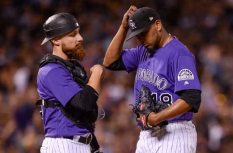 DENVER, CO – AUGUST 18: Jonathan Lucroy #21 and German Marquez #48 of the Colorado Rockies have a word on the mound as Marquez is relieved after making two outs in the sixth inning against the Milwaukee Brewers at Coors Field on August 18, 2017 in Denver, Colorado. (Photo by Dustin Bradford/Getty Images)