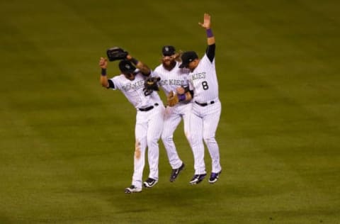 DENVER, CO – AUGUST 29: (L-R) Ian Desmond #20, Charlie Blackmon #19 and Gerardo Parra #8 of the Colorado Rockies celebrate the Rockies 7-3 win against the Detroit Tigers following an interleague game at Coors Field on August 29, 2017 in Denver, Colorado. (Photo by Justin Edmonds/Getty Images)