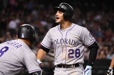 PHOENIX, AZ – SEPTEMBER 11: Nolan Arenado #28 of the Colorado Rockies yells at a fan sitting by the on-deck circle after hitting a three run home run off of Jake Barrett #33 of the Arizona Diamondbacks during the eighth inning at Chase Field on September 11, 2017 in Phoenix, Arizona. (Photo by Norm Hall/Getty Images)