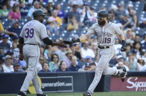 SAN DIEGO, CA – SEPTEMBER 24: Charlie Blackmon #19 of the Colorado Rockies is congratulated by /Stu Cole #39 after hitting a solo home run during the ninth inning of a baseball game against the San Diego Padres at PETCO Park on September 24, 2017 in San Diego, California. (Photo by Denis Poroy/Getty Images)