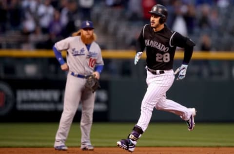 DENVER, CO – SEPTEMBER 29: Nolan Arenado #28 of the Colorado Rockies circles the bases after hitting a solo home run in the first inning against the Los Angeles Dodgers at Coors Field on September 29, 2017 in Denver, Colorado. (Photo by Matthew Stockman/Getty Images)