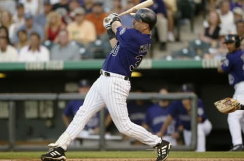 DENVER – JULY 9: Right fielder Larry Walker #33 of the Colorado Rockies hits a two-run double against the San Francisco Giants during the MLB game at Coors Field on July 9, 2003 in Denver, Colorado. The Rockies won 11-7. (Photo by Brian Bahr/Getty Images)